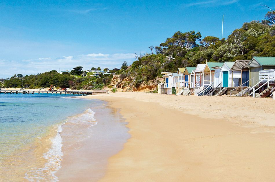 Sandy beach with colourful huts near our Mount Martha retirement village